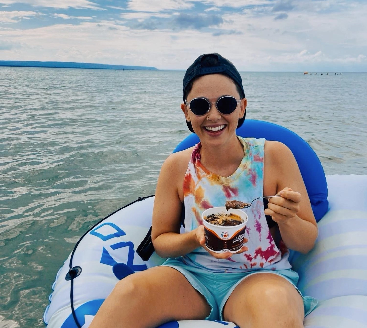 Smoothie Bowl floating on a floatation device on the water at the beach